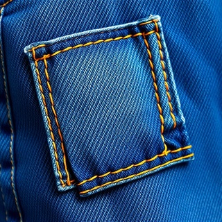Denim patchwork mend with contrasting stitch