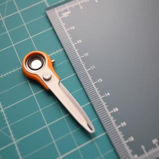 Rotary cutter beside acrylic ruler