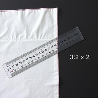 Seam allowance ruler next to paper pattern